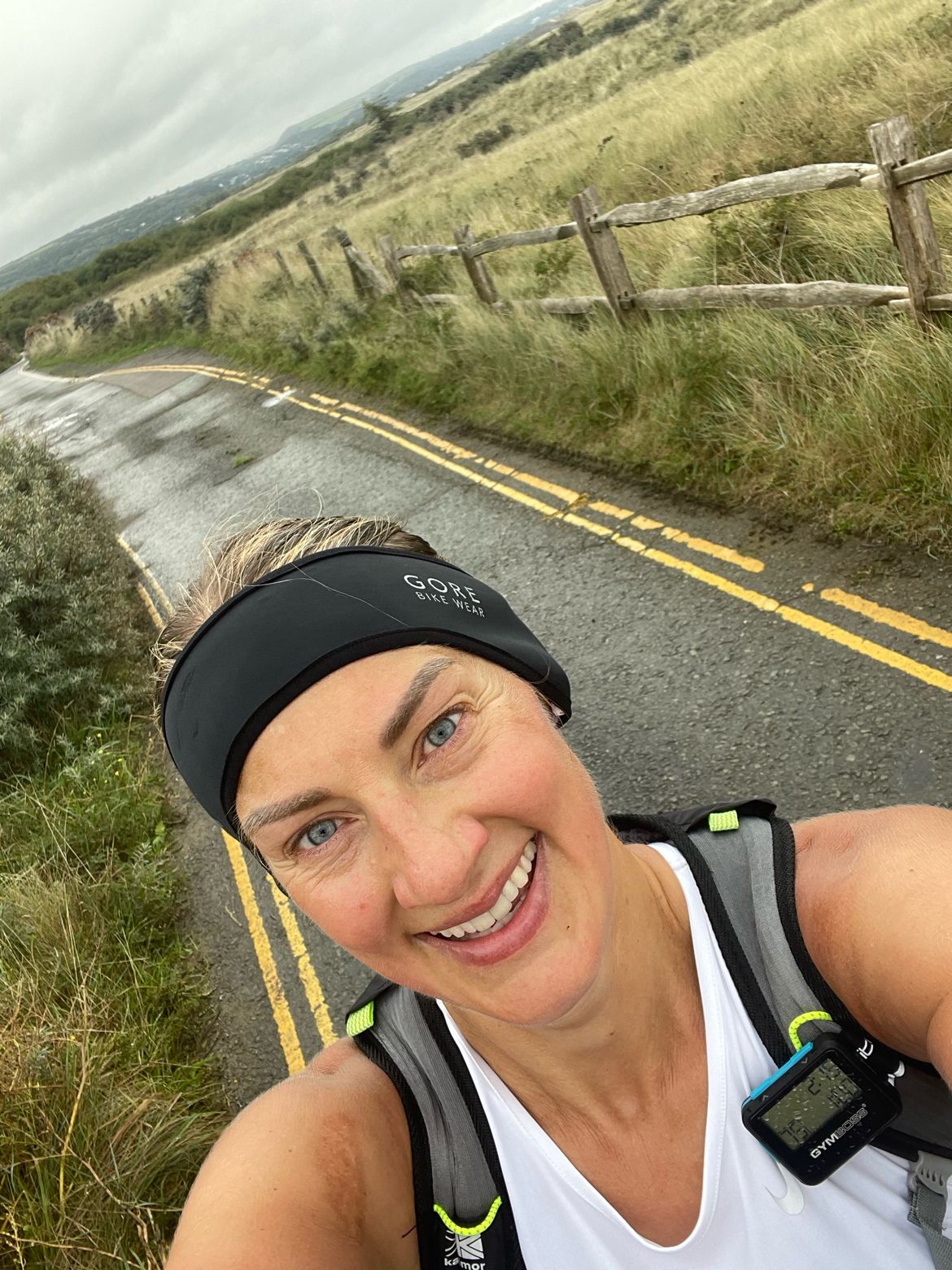 A close-up photo shows Bethan with her blonde hair tied back from her face, on a training run down a country road. Bethan is smiling at the camera. 